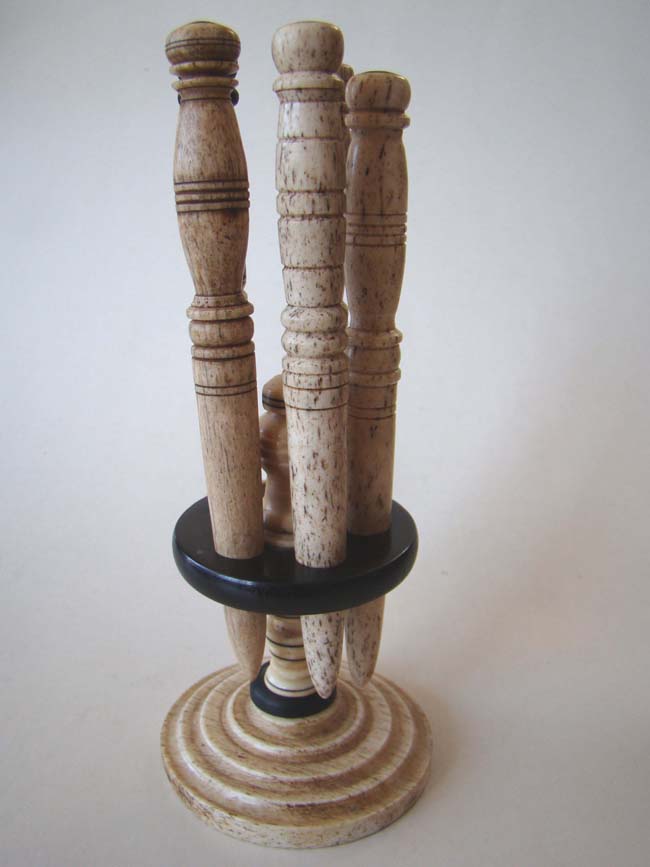A late 19th century whalebone stand holding five fids. — image 3